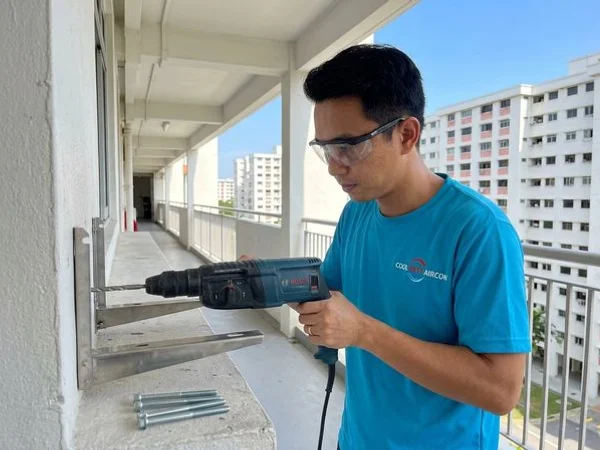 BCA-compliant external aircon bracket installed on an HDB wall